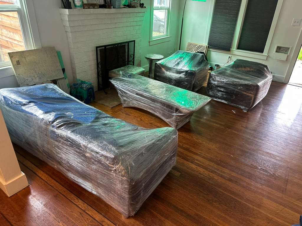 Wrapped living room furniture protected for moving