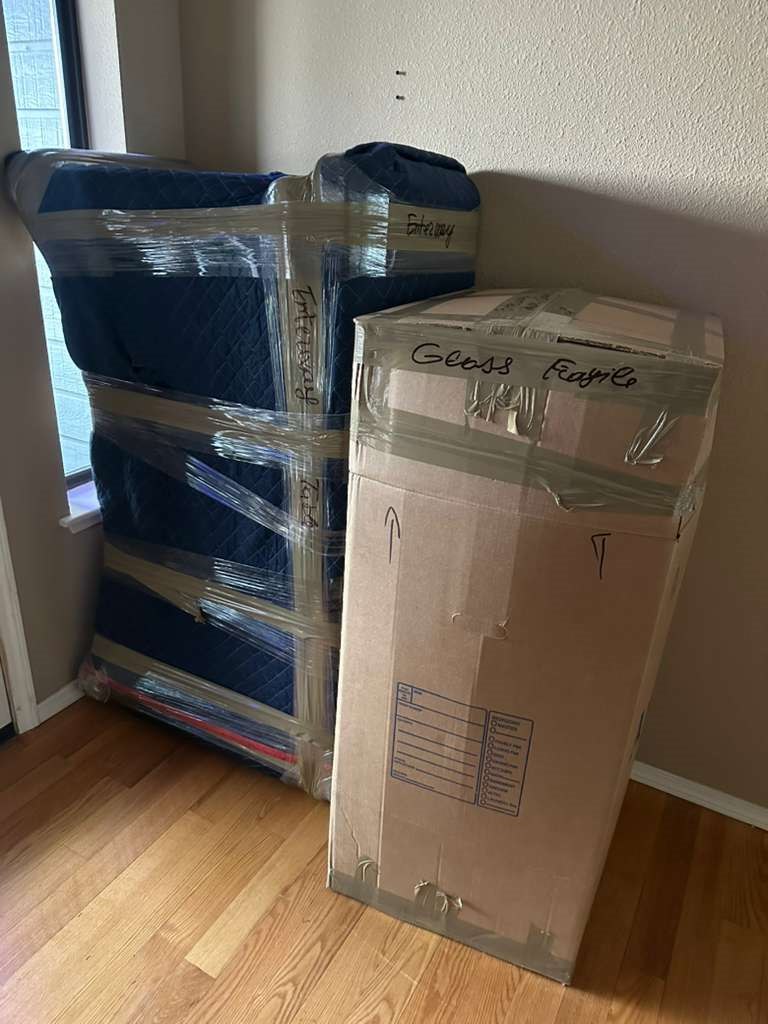 Mattress and fragile box secured with moving wrap
