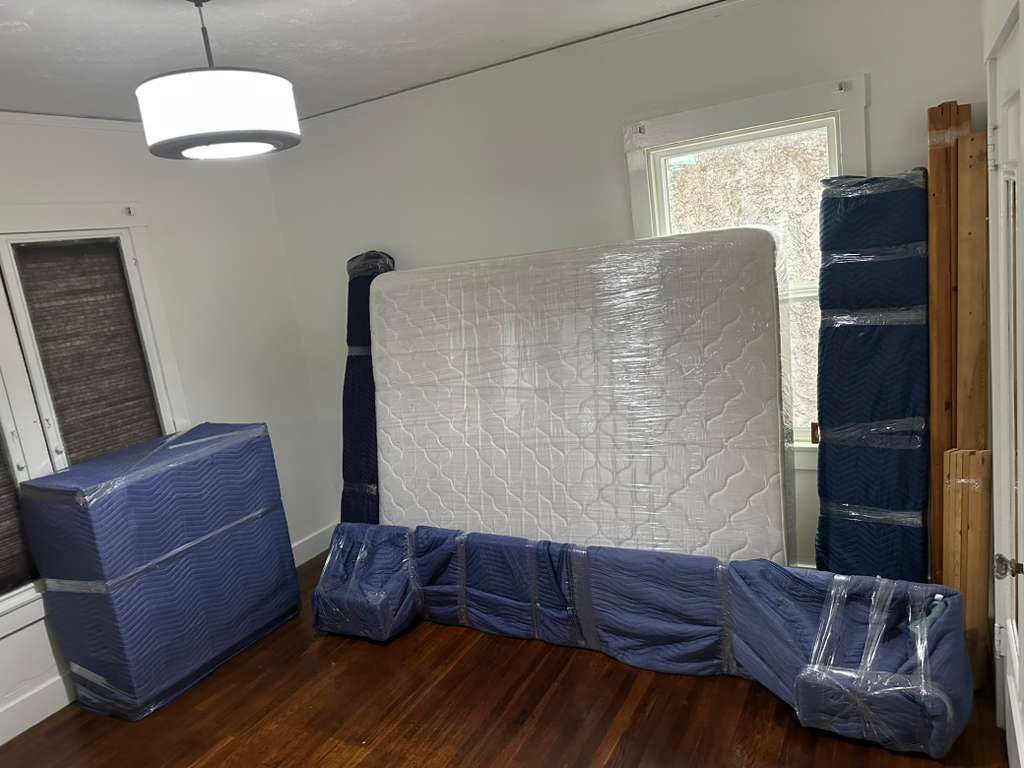Mattress and furniture protected with moving blankets